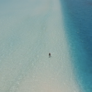 Woman in Sea at Beach Ocean Dimensions Maldives