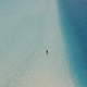 Woman in Sea at Beach Ocean Dimensions Maldives